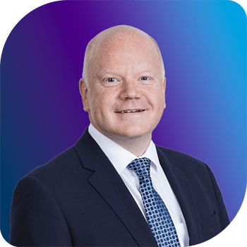 A professional headshot of Peter France