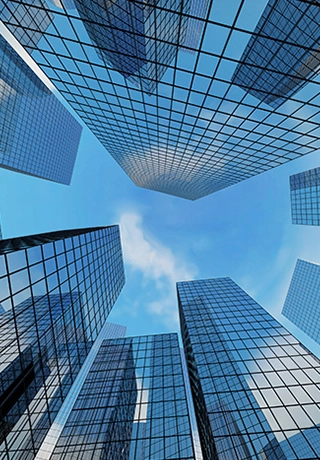 A floor-level view of sky-scraper type buildings surrounding the camera