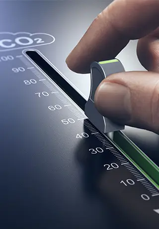 A slider button with fingers about to touch it. The board has Co2 written at the top and the slider is moving downwards