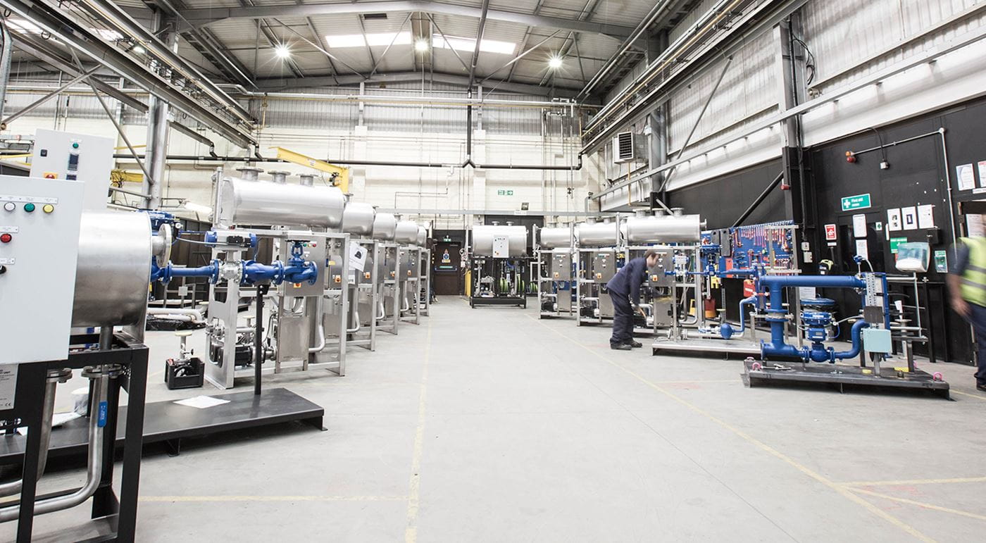 Packaged steam solutions lined up in a warehouse environment