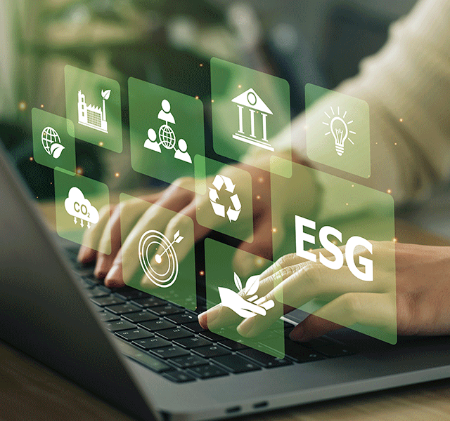 A close up of hands typing at a laptop. Above the hands is a laid over series of icons and graphics that relate to sustainability and ESG, such as the recycle icon, ESG written in letters, a hand holding a shoot of a plant