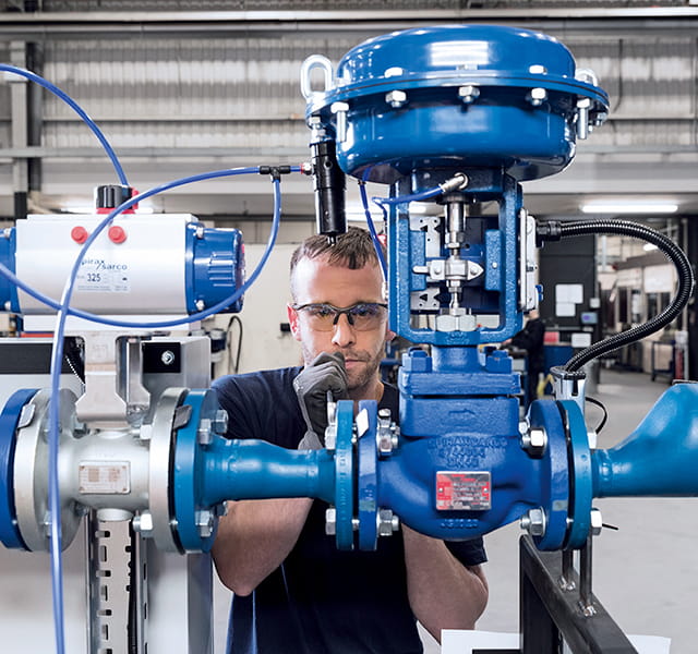 A Spirax Sarco Colleague is inspecting a valve