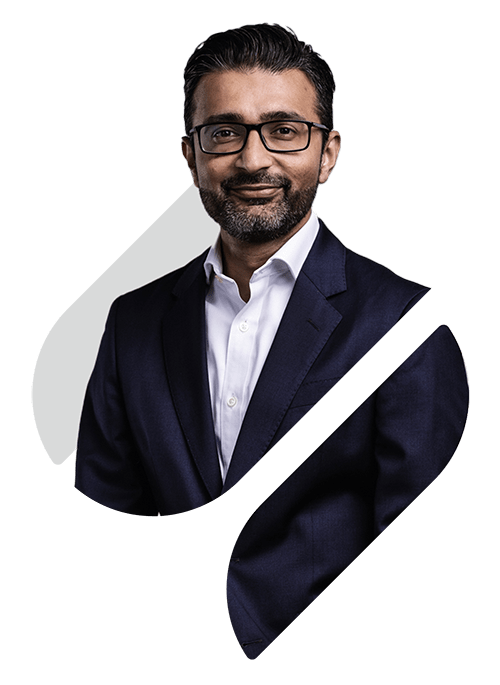 A professional portrait of Nimesh Patel within in the Spirax Group 'S' shape as a cutout 