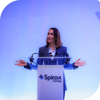 Maria Wilson stood at a podium giving a talk