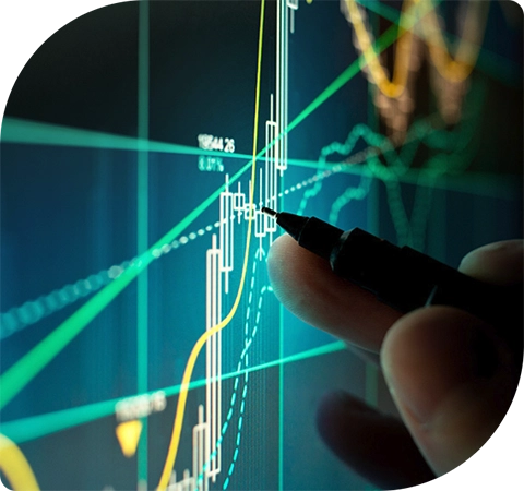 a hand with a pen is hovering over a digital line graph
