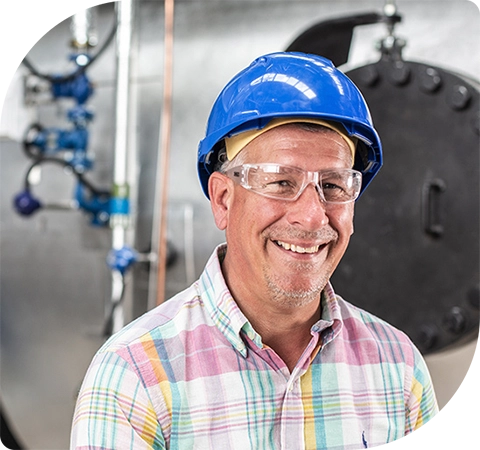 Two hands are holding a tablet. They are wearing gloves. Out of the tablet there are graphics overlaid. Lines come out of the tablet linking to icons that indicate industry and digital connectivity