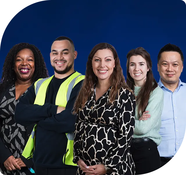 Five colleagues from different cultural backgrounds are standing together in front of a blue background